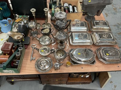 Lot 453 - Quantity of silver plated wares to include two pairs of entree dishes, spirit kettles, and candlesticks.