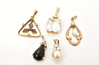 Lot 525 - Cultured pearl and diamond pendant, two 14ct gold gem set pendants and two antique yellow metal open work pendants (5)