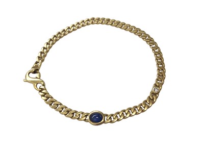 Lot 55 - 18ct gold curb link bracelet set with a cabochon blue sapphire and a brilliant cut diamond