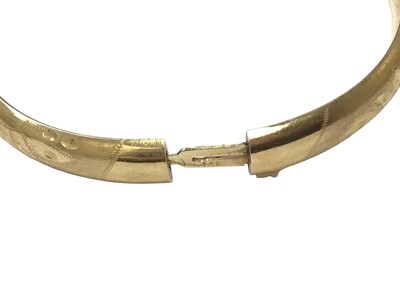 Lot 56 - 14ct gold curb link bracelet and a 14ct gold bangle (2)