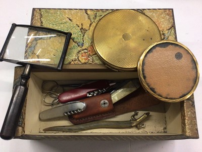 Lot 367 - Vintage box containing penknives, magnifying glass, compacts and a letter opener with lizard terminal