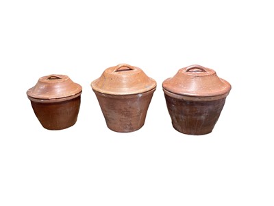 Lot 1646 - Three 19th century and later stoneware bread crocks with lids