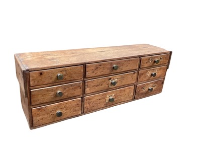 Lot 1663 - Antique bank of nine pine drawers