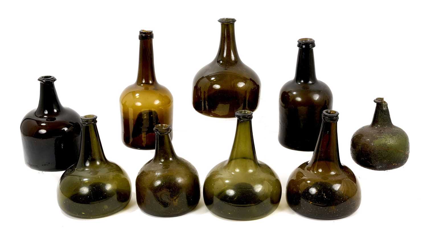 Lot 1670 - Two 18th century Dutch freeblown onion wine bottles, and others (9)