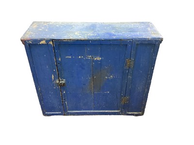 Lot 1742 - Early 19th century, single door pine cupboard, blue painted