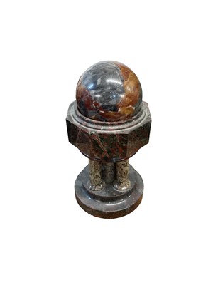 Lot 1596 - Turned marble sphere raised on a stand