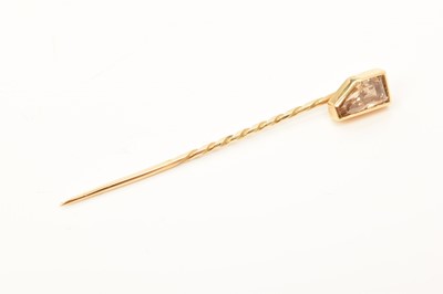 Lot 612 - Diamond stick pin with a fancy colour diamond estimated to weigh approximately 0.75-1.00ct in gold setting