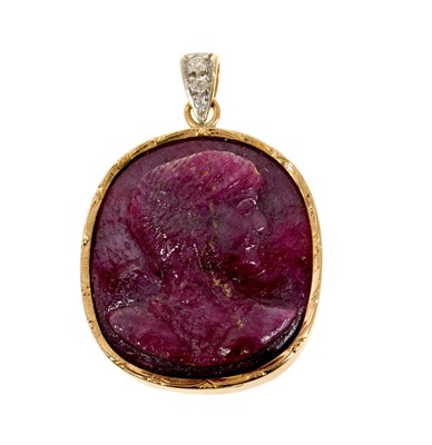 Lot 617 - Cameo carved red/pink stone pendant in 18ct gold mount with diamond set bale