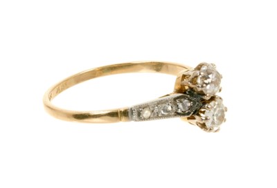 Lot 618 - Antique diamond two stone ring with two old cut diamonds flanked by rose cut diamonds to the shoulders in platinum setting on 18ct gold shank