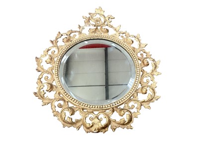 Lot 1270 - Small Florentine style circular mirror in carved gilt pierced frame