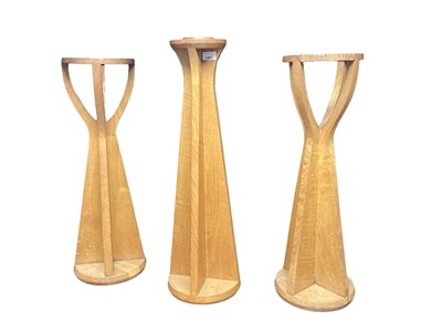 Lot 1300 - Honey oak stand, with dished top and pair of similar candle stands