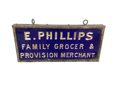 Lot 83 - Original glass-fronted grocer's sign with debossed gilt inscription on a blue ground - 'E. Phillips Family Grocer & Provision Merchant' - in metal frame, 40cm wide