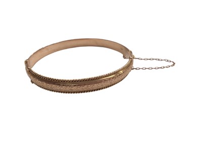 Lot 1094 - 9ct rose gold bangle