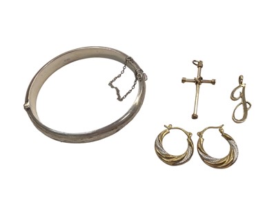 Lot 1096 - Pair of 9ct yellow and white gold hoop earrings, 9ct gold J initial pendant, yellow metal cross pendant and a silver bangle