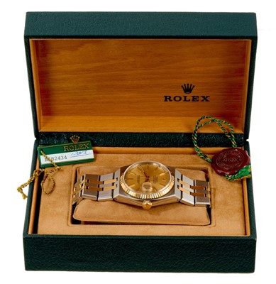 Lot 722 - Gentlemen's Rolex Oysterquartz Datejust chronometer wristwatch, model 17013, with champagne coloured dial, gold bezel, in stainless steel Oyster case on bi-metal integral bracelet, with original gu...