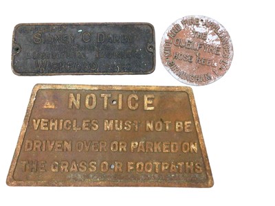 Lot 91 - Group of four  relief cast metal signs, including one for 'Sidney C Darby' agricultural engineers, Wickford, one for 'The Quelfyre Hose Reel', and one other vehicle notice (3)