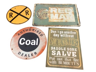 Lot 93 - American 'Red Man' tobacco sign, an American road sign, a Coal dealer sign, and a reproduction Saddle Salve sign (4)