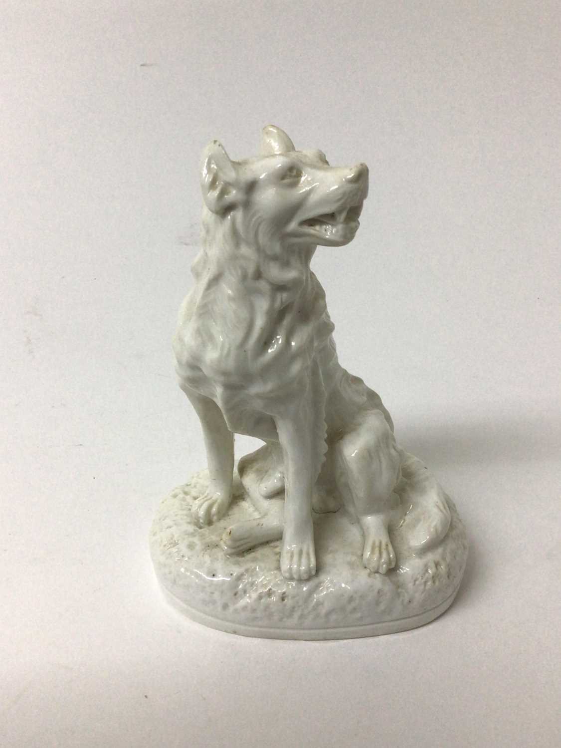 Lot 130 - Derby Stephenson & Hancock white glazed model of a dog, shown seated on an oval base, inscribed mark to base