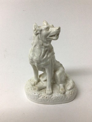 Lot 250 - Derby Stephenson & Hancock white glazed model of a dog, shown seated on an oval base, inscribed mark to base