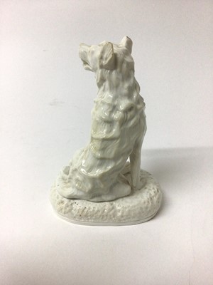 Lot 130 - Derby Stephenson & Hancock white glazed model of a dog, shown seated on an oval base, inscribed mark to base