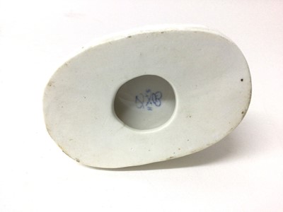 Lot 130 - Derby Stephenson & Hancock white glazed model of a dog, shown seated on an oval base, inscribed mark to base