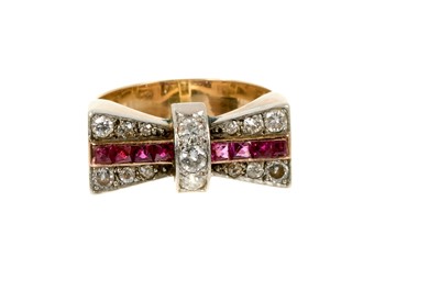 Lot 455 - Art Deco Odeonesque diamond and ruby ring in the form of a bow, circa 1950.