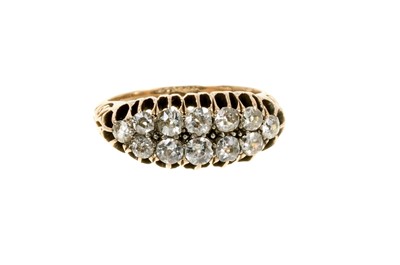 Lot 459 - Victorian diamond two-row ring with graduated old cut diamonds in gold claw setting with carved gold shoulders