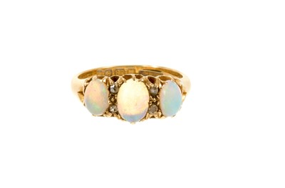 Lot 461 - Edwardian opal and diamond ring with three oval cabochon opals interspaced by four diamonds in gold claw setting on 18ct gold shank (Birmingham 1906)