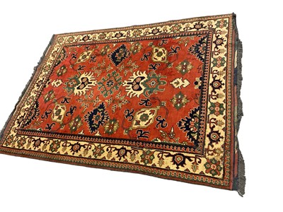 Lot 1534 - Caucasian Kasak rug, with angular foliate design on brick red ground