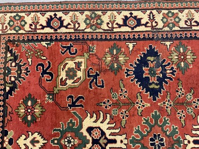 Lot 1534 - Caucasian Kasak rug, with angular foliate design on brick red ground