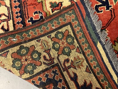 Lot 1534 - Caucasian Kasak rug, with angular foliate design on brick red ground