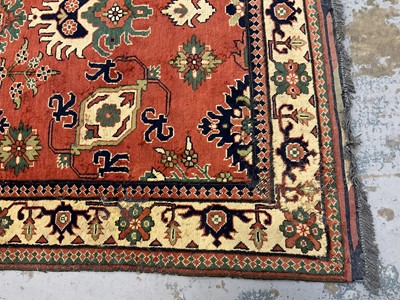 Lot 1534 - Caucasian Kasak rug, with angular foliate design on brick red ground