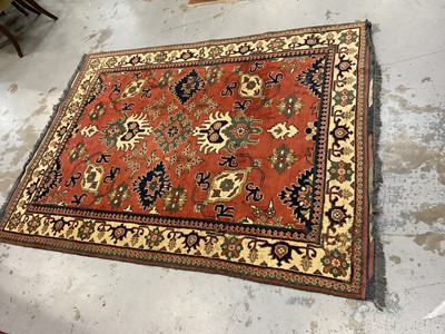 Lot 1534 - Caucasian Kasak rug, with angular foliate design on brick red ground