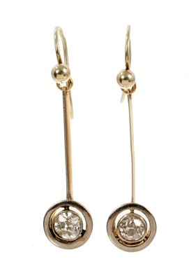 Lot 470 - Pair of Edwardian diamond pendant earrings, each with an old cut diamond in platinum millegrain setting with target shape platinum border and knife edge bar. Estimated total diamond weight approxim...