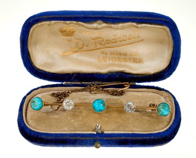 Lot 471 - Late Victorian turquoise and diamond bar brooch with two old cut diamonds and three round turquoise cabochons in millegrain setting on gold knife edge bar.