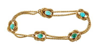 Lot 472 - Late Victorian gold and turquoises bracelet, the double strand with a knotted design set with turquoise cabochons