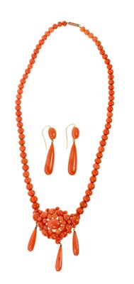 Lot 476 - Victorian coral necklace with a cluster of coral beads suspending three pear shape coral pendant drops, on a graduated coral bead chain, together with a pair of similar pendant drop earrings