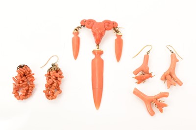 Lot 478 - Group of antique coral jewellery to include a brooch with a finely carved coral ram's head suspending three spear head coral drops with gold frog mounts, a coral brooch and earrings each with a car...