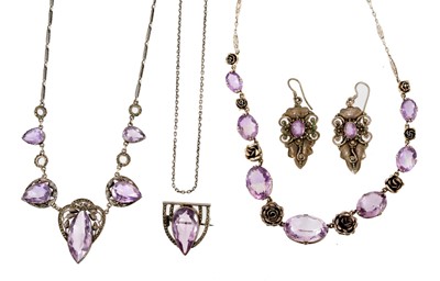 Lot 480 - An Art Deco amethyst and silver necklace, another with silver roses and oval mixed cut amethysts, a pair of earrings and a brooch.