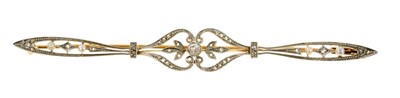 Lot 486 - Edwardian Belle Époque diamond and seed pearl bar brooch, the openwork foliate scrolls with old cut and rose cut diamonds and seed pearls in platinum setting on gold pierced gallery.