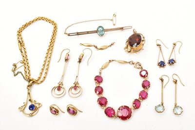 Lot 489 - Group of Edwardian gold and gem-set jewellery to include a red stone bracelet in gold setting engraved '15ct', pendant on chain, one other pendant, a bar brooch and four pairs of earrings