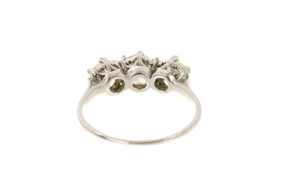 Lot 630 - Diamond three stone ring with three round brilliant cut diamonds, estimated to weigh approximately 1.4cts in total in claw setting on platinum shank