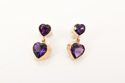 Lot 432 - Pair of amethyst heart shaped pendant earrings, each with two heart shaped amethysts suspended from post and butterfly fittings, Birmingham 2001