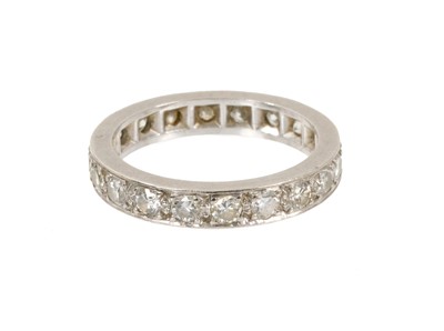 Lot 566 - Diamond eternity ring with a full band of 20 brilliant cut diamonds estimated to weigh approximately 1.8-2.0cts in grain setting, ring size N.