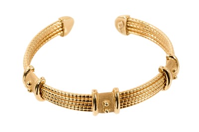 Lot 574 - 18ct gold torque bangle with applied beaded gold bands, London 1998.