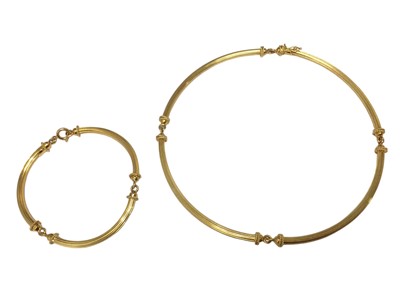 Lot 18 - Italian 18ct gold necklace and matching bracelet composed of curved tubular gold links