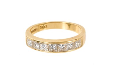 Lot 580 - Diamond eternity ring with seven princess cut diamonds in 18ct yellow gold channel setting, London 1993. Estimated total diamond weight approximately 1.4cts. Ring size O½.