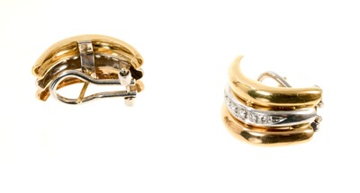 Lot 582 - Pair of 18ct three-colour gold and diamond earrings with brilliant cut diamonds in white, rose and yellow gold setting with omega clip and post fittings, 21mm.