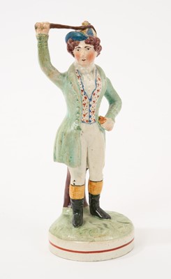 Lot 157 - Rare early 19th century Staffordshire pearlware-glazed figure of Maria Foote in the role of Arinette as a jockey, ex-Brian Odell collection, 17.5cm high