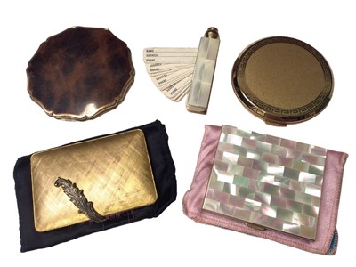 Lot 161 - Four vintage powder compacts including two Stratton, one mother of pearl and one Italian gilt metal, together with a mother of pearl address card holder (5)
